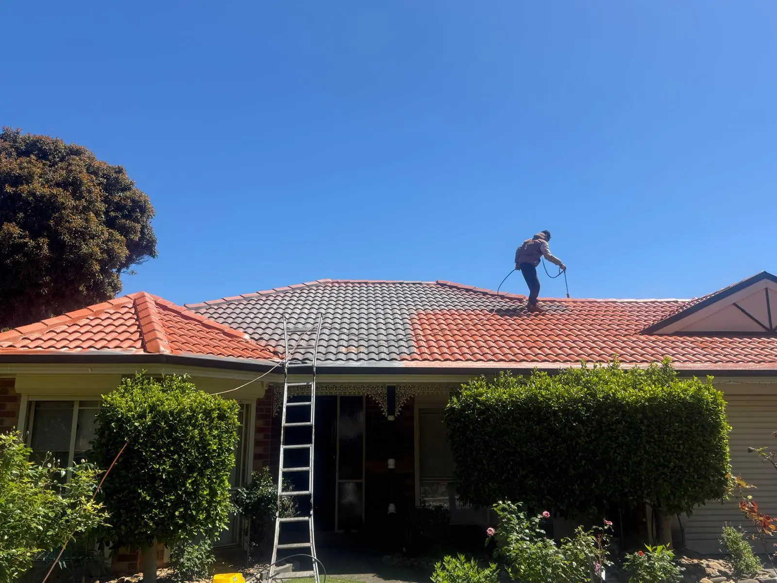 YSM Worker Repainting the Roof